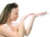 Beautiful girl with bath foam in her hands